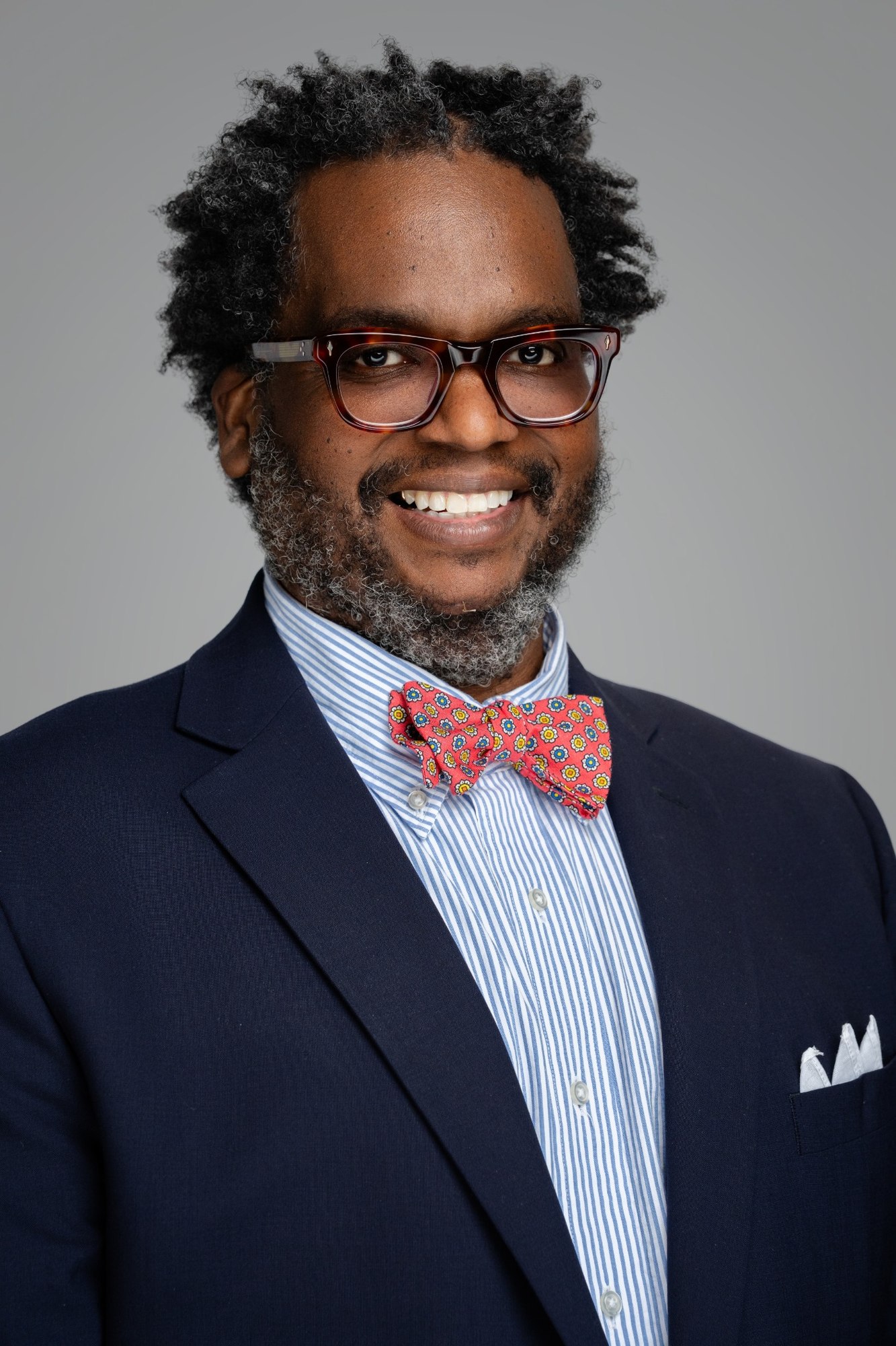 Professional headshot of a man wearing a bow tie